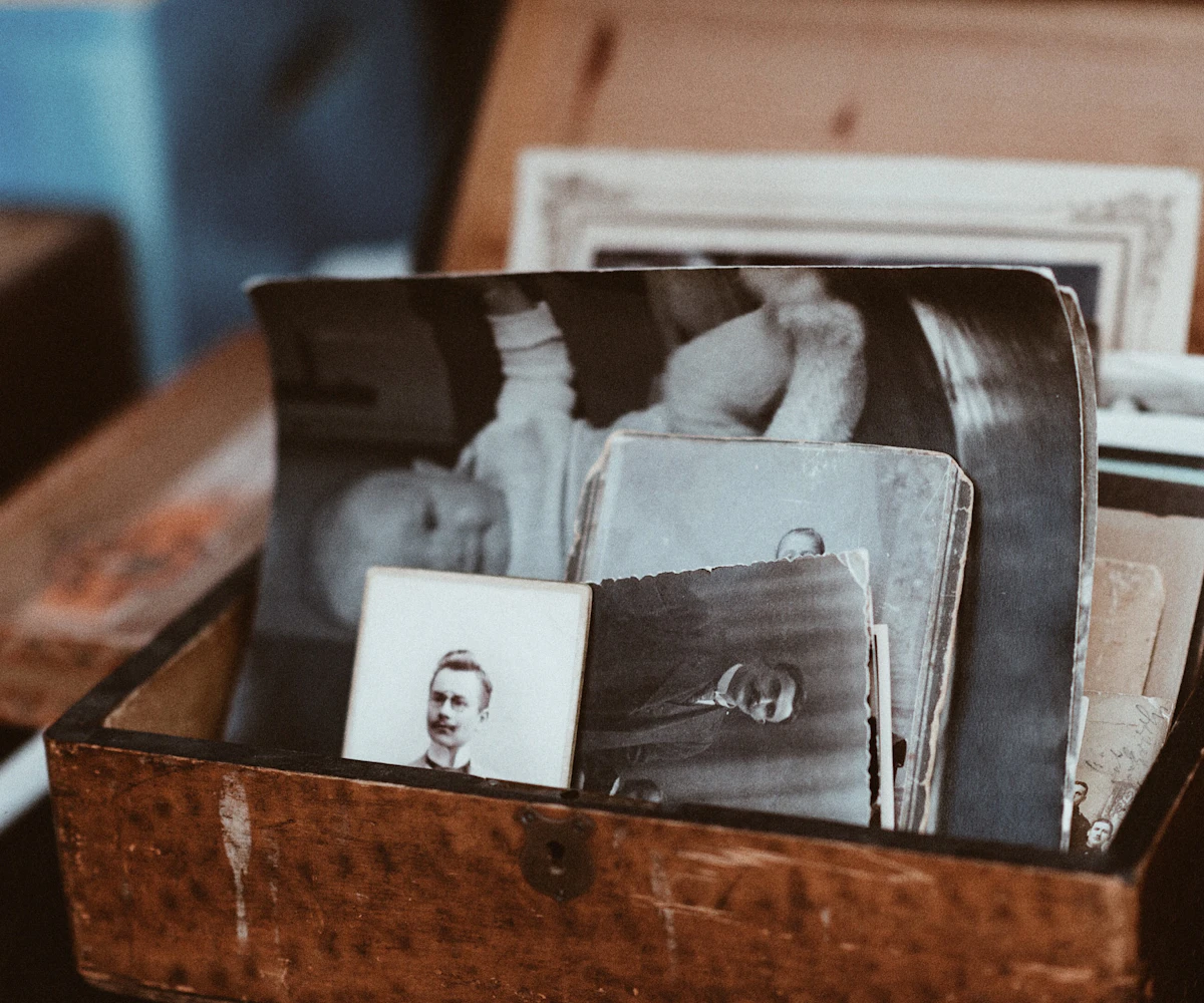 Old photographs gathered in a wooden chest